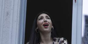 Italian opera singer Laura Baldassari sings from her apartment window.