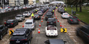 Cars queue for testing at SydPath’s Bondi Beach testing clinic on Monday.