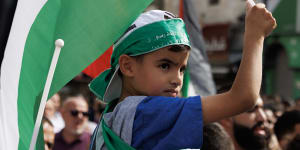 Hamas is not a fringe movement but has popular support among Palestinians. A boy wearing a Hamas headband holds a Palestinian flag as protesters gather in Ramallah,West Bank. 