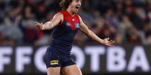 Jackson celebrates a goal during the round 15 match between the Demons and Lions in June. 