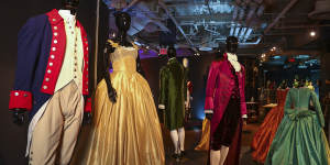 Costumes from the Broadway musical Hamilton are displayed at the Showstoppers! Spectacular Costumes from Stage&Screen exhibit in Times Square in 2021.
