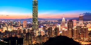 Taipei World Trade Center and Taipei 101 in Xinyi Business District at dusk.