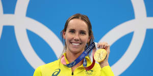 Emma McKeon with her 50m freestyle gold from Tokyo,one of a record seven medals she claimed in the Olympic pool.