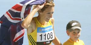 Australia's Kerryn McCann celebrates her marathon victory with son Benton.
