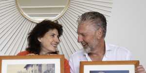 Rob and Leonie Klaric,posing next to their pictures from 1988.