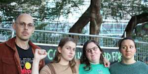 Kurilpa Commons members Shane Cucow,Jemika Lancaster and Jess Wallace at the gardens on Monday as police and government workers fenced it off.