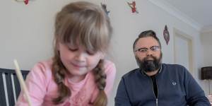 Disability worker David Wragg,at home with his daughter Elissa,has serious misgivings about the quality of her remote education. 