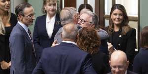 Prime Minister Anthony Albanese embraces former defence minister Joel Fitzgibbon,following a condolence motion for his son Lance Corporal Jack Fitzgibbon.