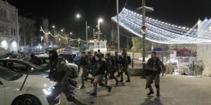 Israeli Border Police are deployed near the Damascus Gate to the Old City of Jerusalem during a raid by police at the al-Aqsa Mosque compound on Wednesday.