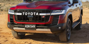 The government has reclassified cars like the Toyota LandCruiser as light commercial vehicles,cutting the emission targets they would have to meet. 