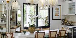 The dining area features a custom table from Camargue,in Mosman,which seats eight on 1950s Italian oak chairs. Overhead are Arteriors “Tilda” chandeliers.