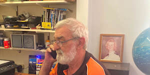 Lyndon Pelly with a photograph of his daughter Midshipman Megan Pelly,who died in the fire on the HMAS Westralia.