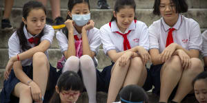 Beijing says the new rules will reduce the financial burden of education on parents.