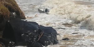 Ute caught out as Tropical Cyclone Oma whips up big swell