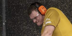 Grafton athlete Chris Owen holding a 30-kilogram chainsaw in the 2020 Virtual Australian championships.