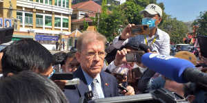US ambassador Patrick Murphy speaks to reporters outside the court in Phnom Penh on Friday.