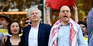 John Keane (centre) and Nick Riemer (right) at a rally ahead outside the Federal Court last year. 