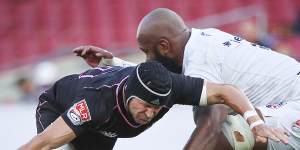 Matt Giteau is tackled by Apisai Naikatini of Old Glory DC in the MLR.
