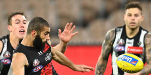 Essendon's Adam Saad under pressure.