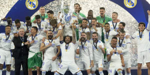 Real Madrid’s Marcelo lifts the trophy after winning the Champions League final soccer match against Liverpool.