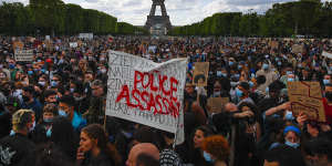  Demonstrators gather on the Champs de Mars in Paris. 