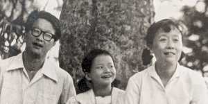 Journalist Cheng Lei (centre,aged 9) with dad Chu-yong and mum Hua in Hunan province,China,1984,right before Chu-yong came to Australia as a visiting scholar.