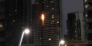 Flammable cladding on the Neo 200 apartment tower in Spencer Street burnt in February. The tower will now get public funding to remove any remaining flammable cladding.