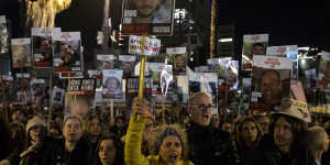 A protest in Tel Aviv where people hold signs and photos of hostages,calling for their release. 