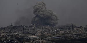 Smoke and explosions rise inside the Gaza Strip,as seen from southern Israel on Sunday.