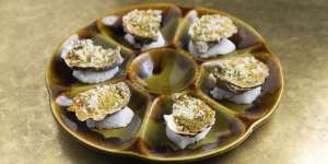 Baked oysters a la Poodle are a riff on oysters Rockefeller.