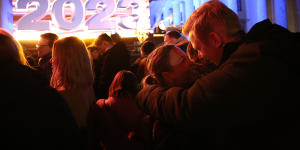 Visitors attend New Year’s celebrations at the Brandenburg Gate on December 31,2023 in Berlin,Germany. 