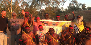 Thomas Mayor (far left) takes the Uluru Statement canvas to the Yule River Bush meeting in the Pilbara. 