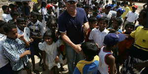 Warne joins forces with Muralitharan at a Tsunami refugee camp in Galle,Sri Lanka