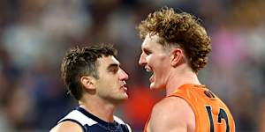 Tom Green and Shaun Mannagh exchange pleasantries late in the Cats’ loss to the Giants.