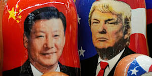 Traditional Russian wooden dolls called Matryoshka depicting China’s President Xi Jinping and President Donald Trump.