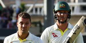 Alex Carey and Josh Hazlewood leave the field after losing the Oval Test to draw the Ashes series.
