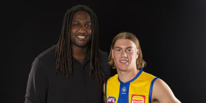 Harley Reid of the Eagles poses for a photograph with retired Eagles star Nic Naitanui.