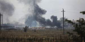 Smoke rises over the site of explosion at an ammunition storage of Russian army near the village of Mayskoye,Crimea.
