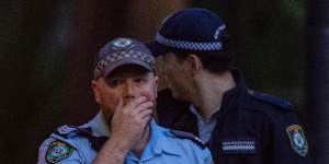 Police at the park in Annandale where a man was stabbed.