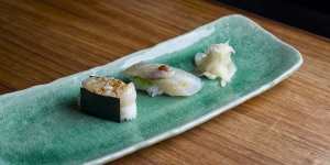 Saki-sushi,featuring the fish of the day,one cured in kombu sheets,the other seasoned two ways.