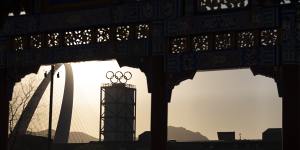 The Olympic logo seen through a paifang,a traditional Chinese gateway arch. 