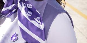 The uniform includes a purple scarf that can be worn as a hair,neck or pocket accessory.