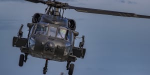 A Philippine Black Hawk helicopter takes off during a US naval exercise. 