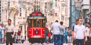 Red trams trundle along Istiklal Caddesi,the city's long,narrow and notoriously crowded avenue-cum-pedestrianised shopping mall.