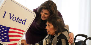 Republican presidential candidate Nikki Haley helps her mother,Raj Kaur Randhawa,to the voting booth on Saturday in Kiawah Island,South Carolina.