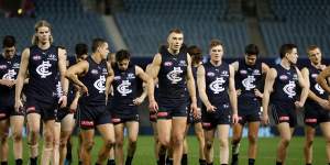 The Blues look dejected after their loss against North Melbourne on Saturday.