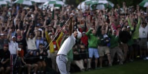 A jubilant Adam Scott celebrates his 2013 Masters win on the second play-off hole at Augusta National.