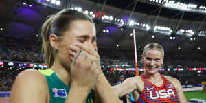 Katie Moon (right) congratulates Nina Kennedy as they share the gold medal in the women’s pole vault at the world championships in Budapest. 