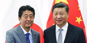 Chinese President Xi Jinping,right,with Japanese Prime Minister Shinzo Abe,representing two of Australia's most important trading partners.