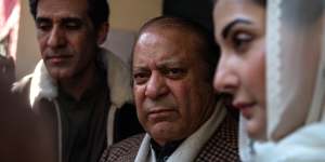 Nawaz Sharif,Pakistan’s former prime minister,center,and his daughter Maryam Nawaz Sharif,right,at a polling station in Lahore on Thursday.